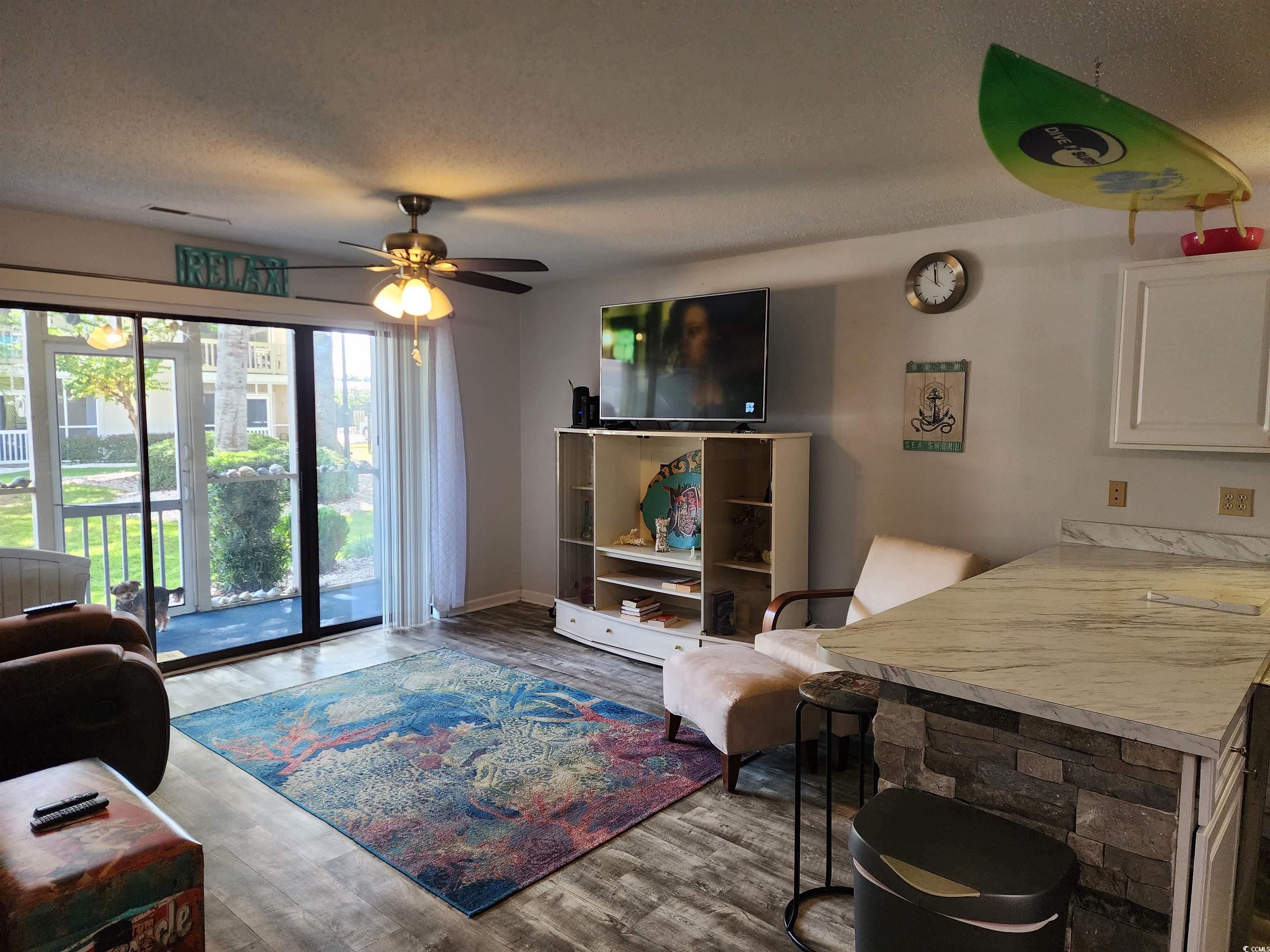 1870 Auburn Lane Surfside Beach, SC 29575 - Photo 5 of 18 Living room with a textured ceiling, ceiling fan,