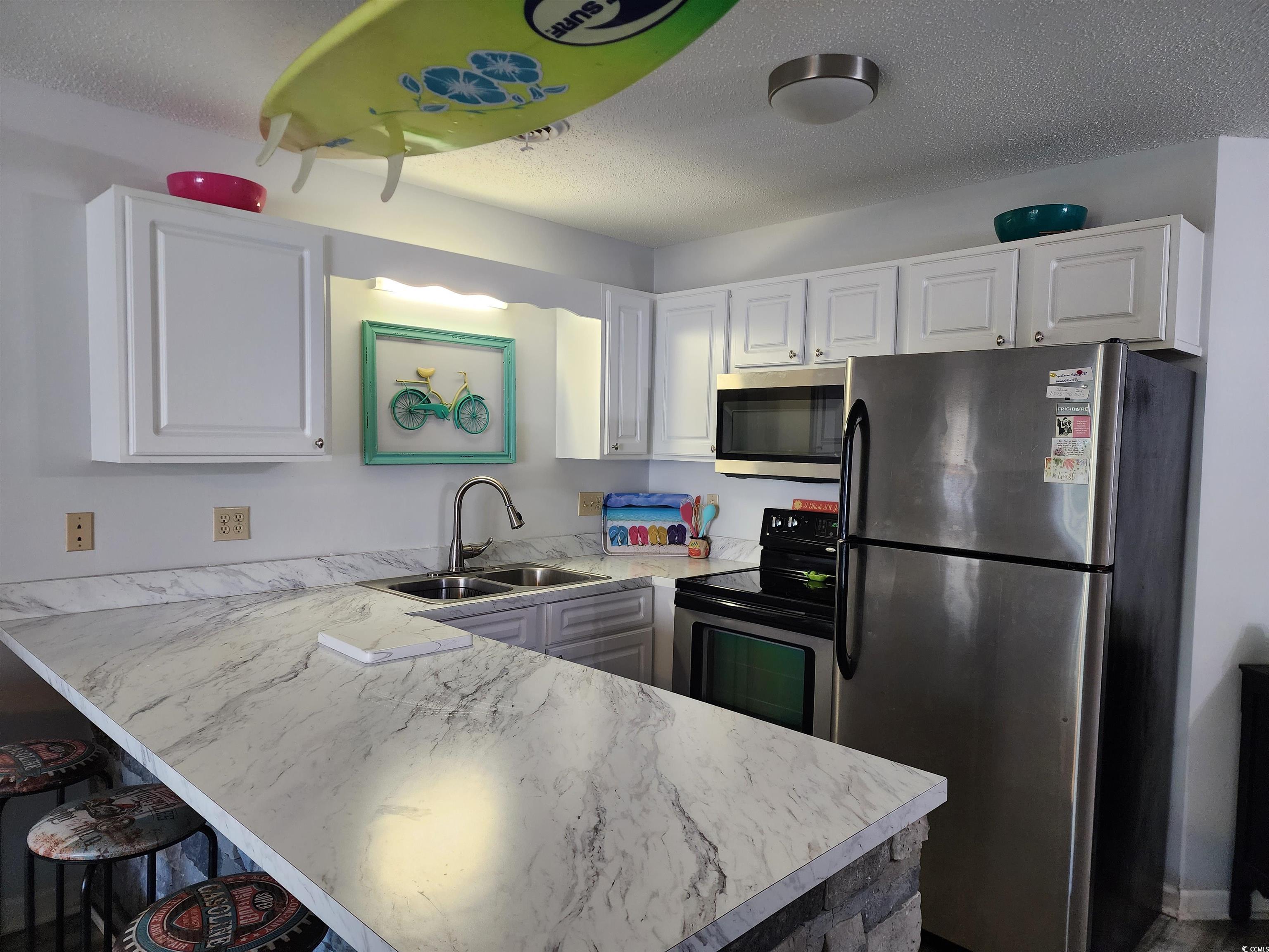 1870 Auburn Lane Surfside Beach, SC 29575 - Photo 7 of 18 Kitchen with sink, stainless steel appliances, whi
