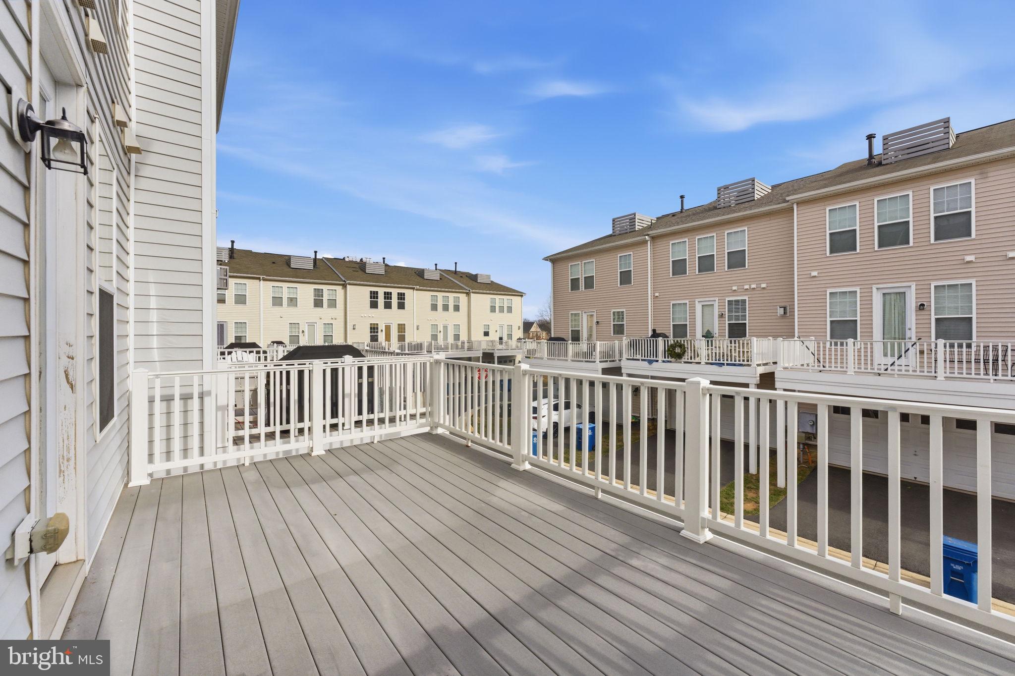 42396 Benfold Square Brambleton, VA 20148 - Photo 18 of 65 a view of a brick building from a balcony