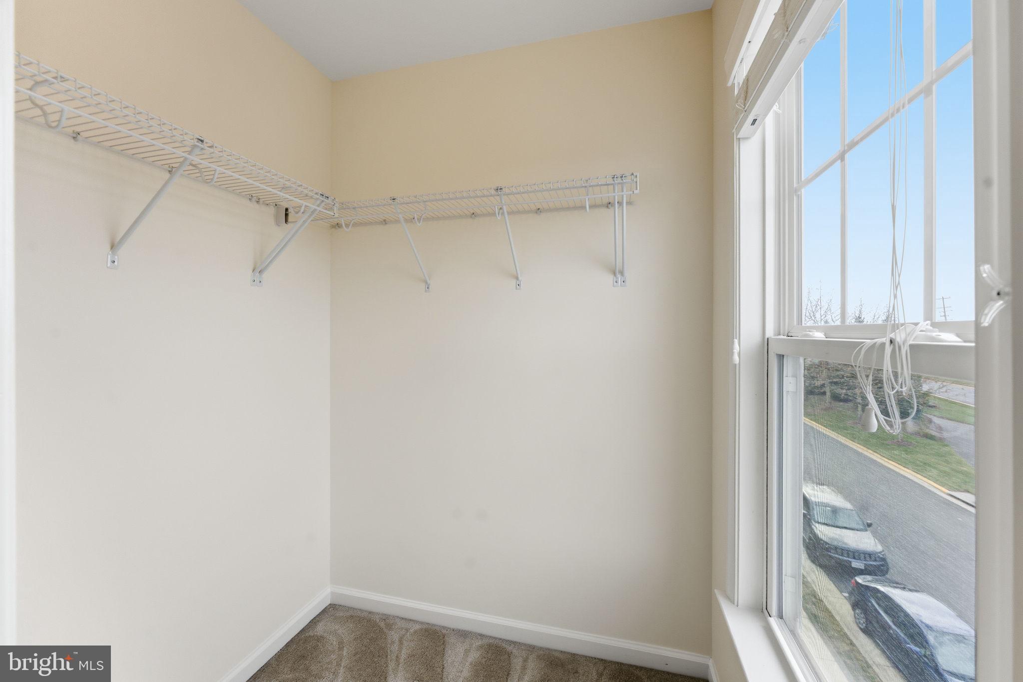42396 Benfold Square Brambleton, VA 20148 - Photo 33 of 65 a view of a room with racks on the wall