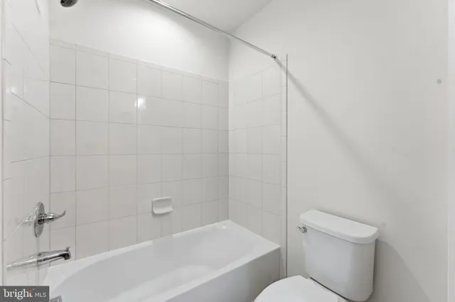 a front view of a building with parking space