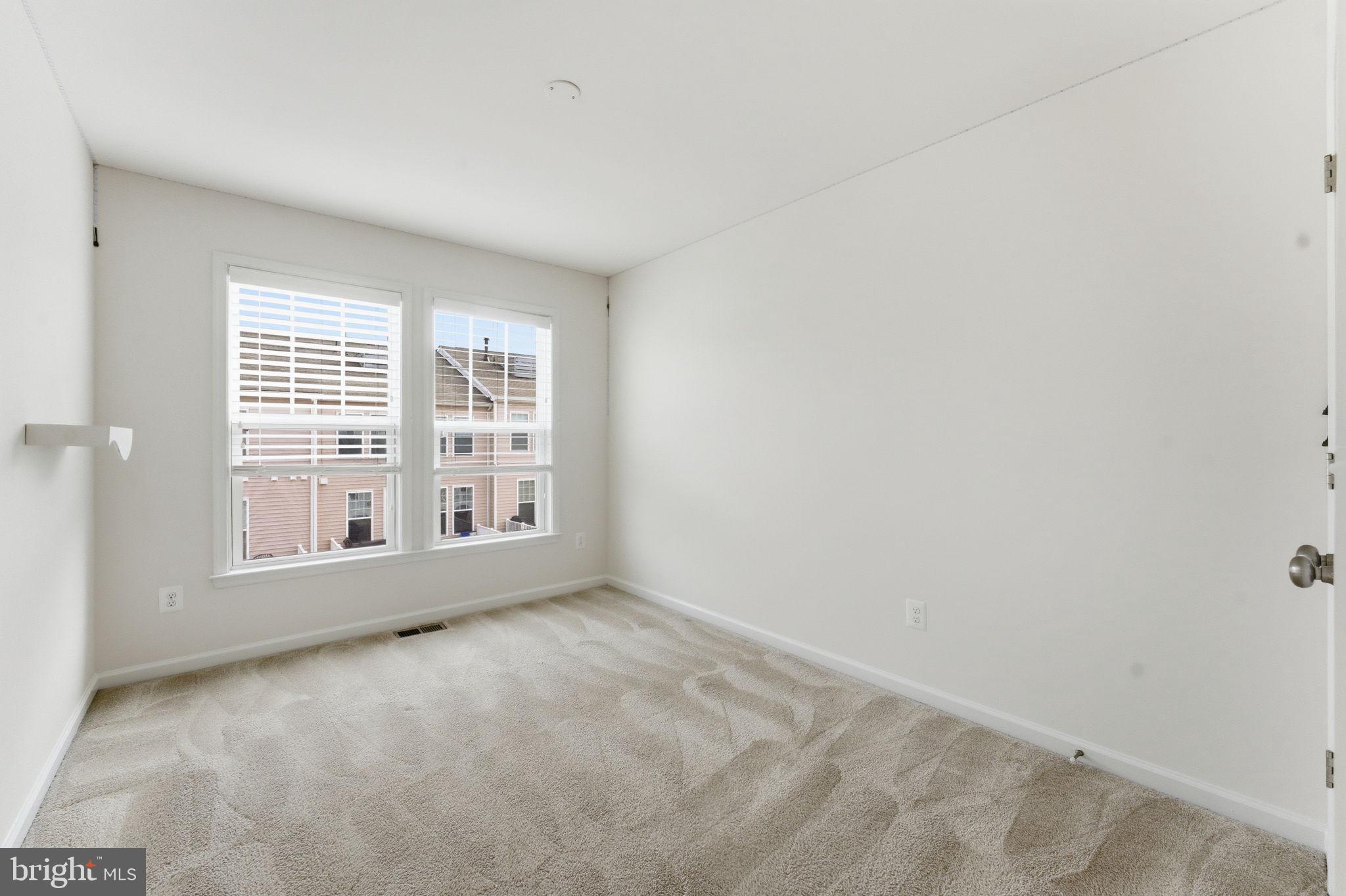42396 Benfold Square Brambleton, VA 20148 - Photo 39 of 65 a view of an empty room with a window