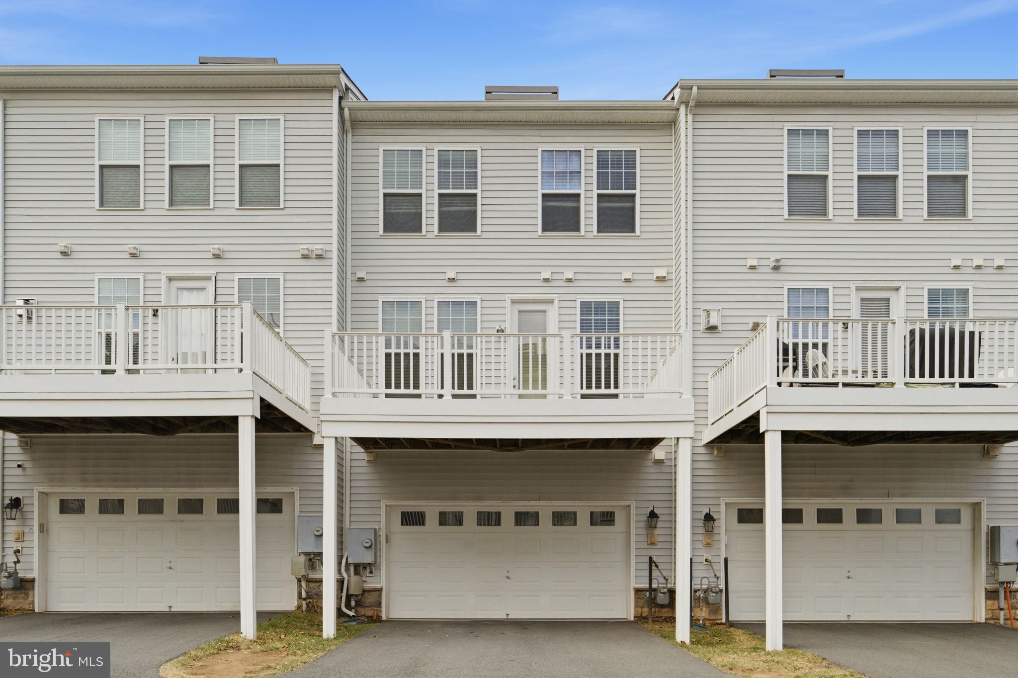 42396 Benfold Square Brambleton, VA 20148 - Photo 43 of 65 a front view of a building with a street