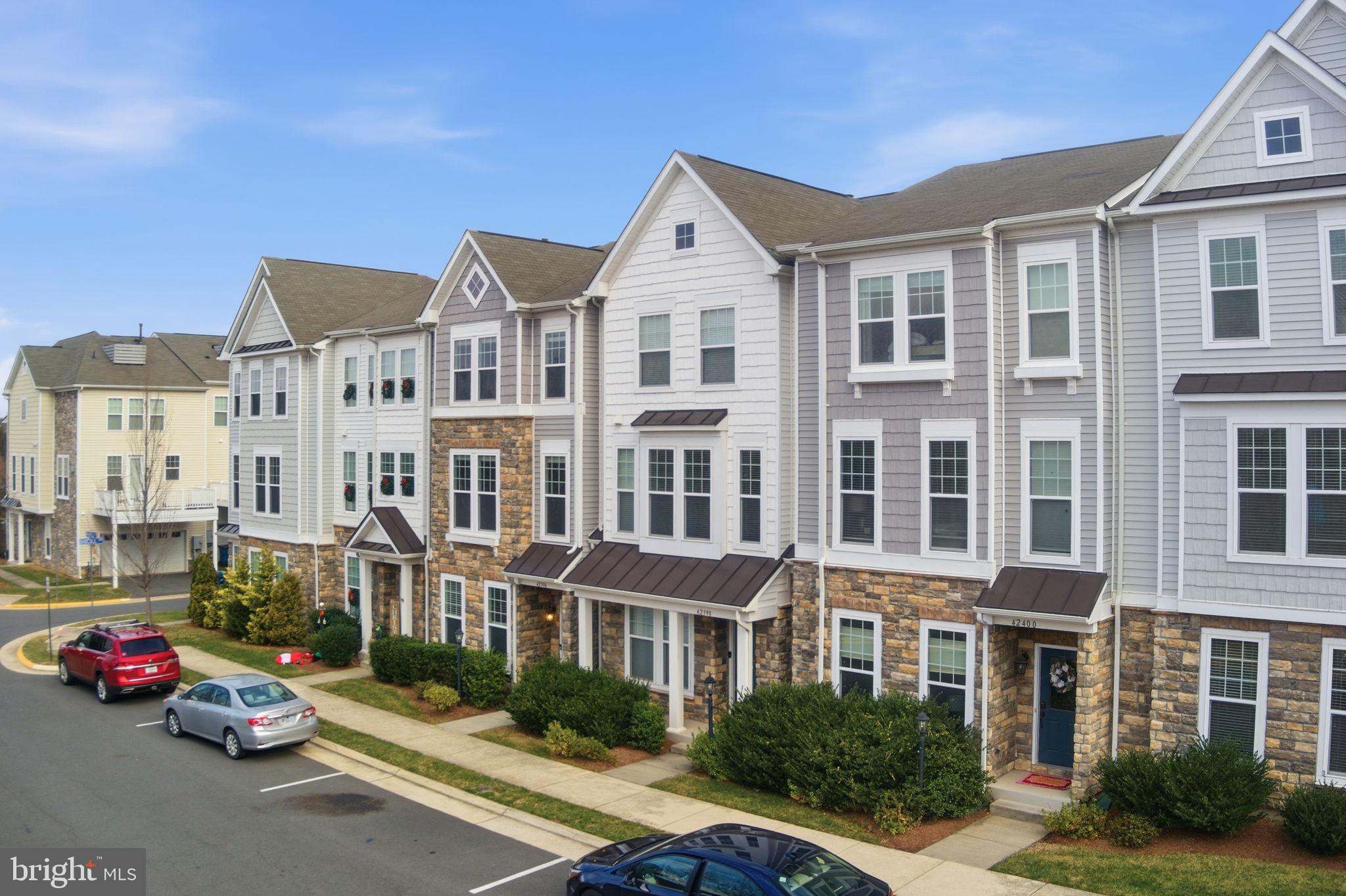 42396 Benfold Square Brambleton, VA 20148 - Photo 49 of 65 a car parked in front of a building