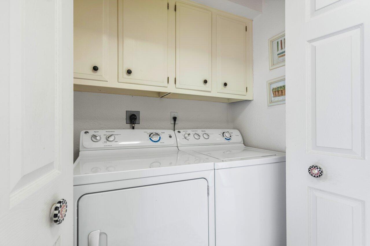 4024 Shelldrake Lane, Unit SHELLDRAKE Boynton Beach, FL 33436 - Photo 22 of 51 a utility room with dryer and washer