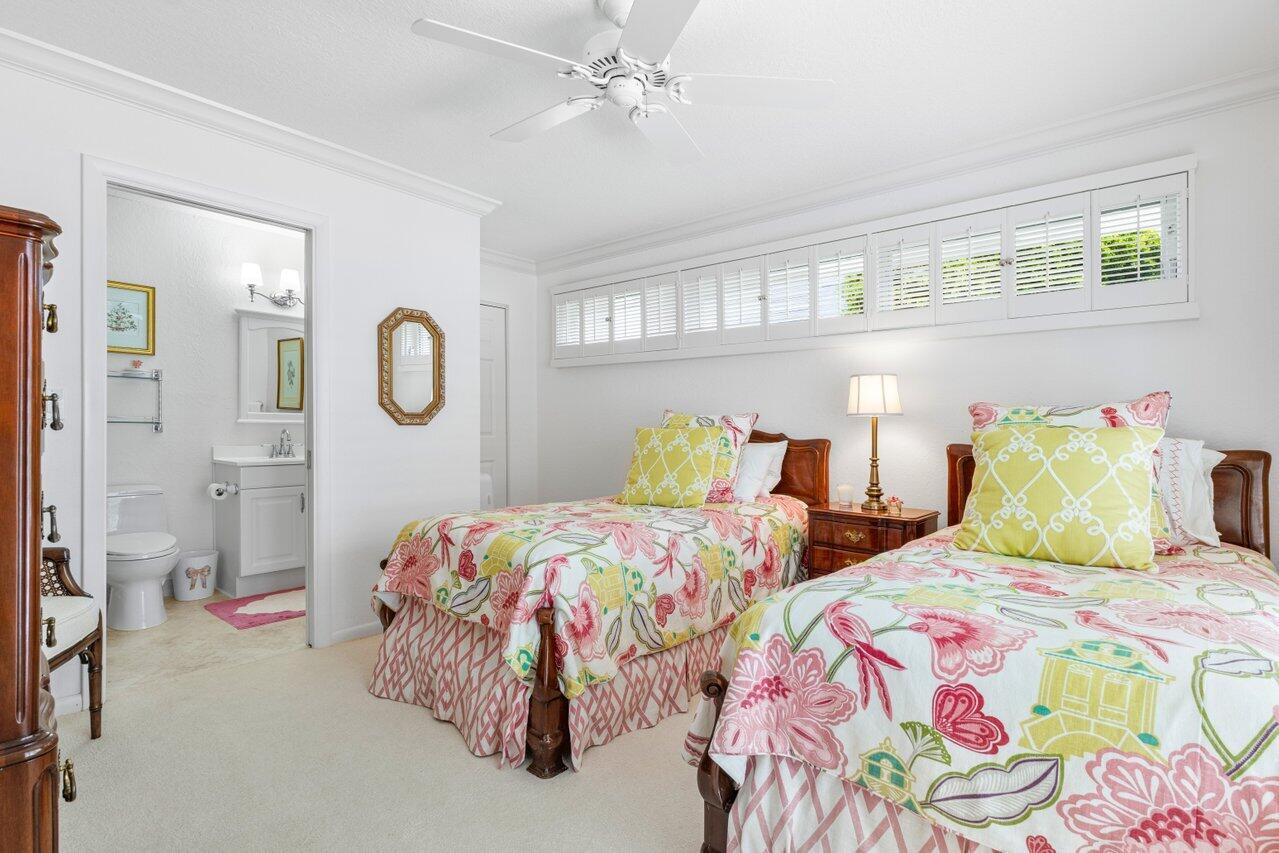 4024 Shelldrake Lane, Unit SHELLDRAKE Boynton Beach, FL 33436 - Photo 23 of 51 a bedroom with two beds and painting on the wall