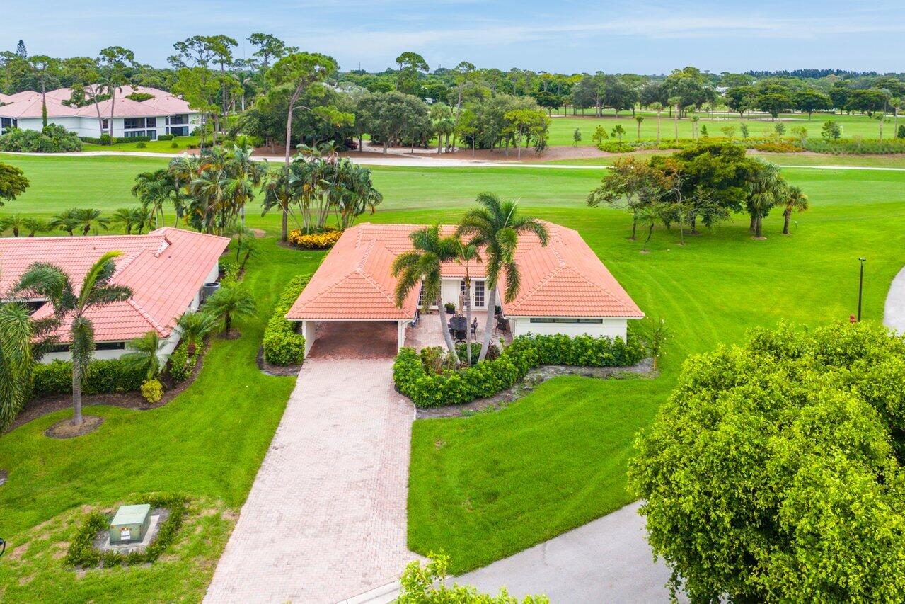 4024 Shelldrake Lane, Unit SHELLDRAKE Boynton Beach, FL 33436 - Photo 40 of 51 a view of a garden with an ocean