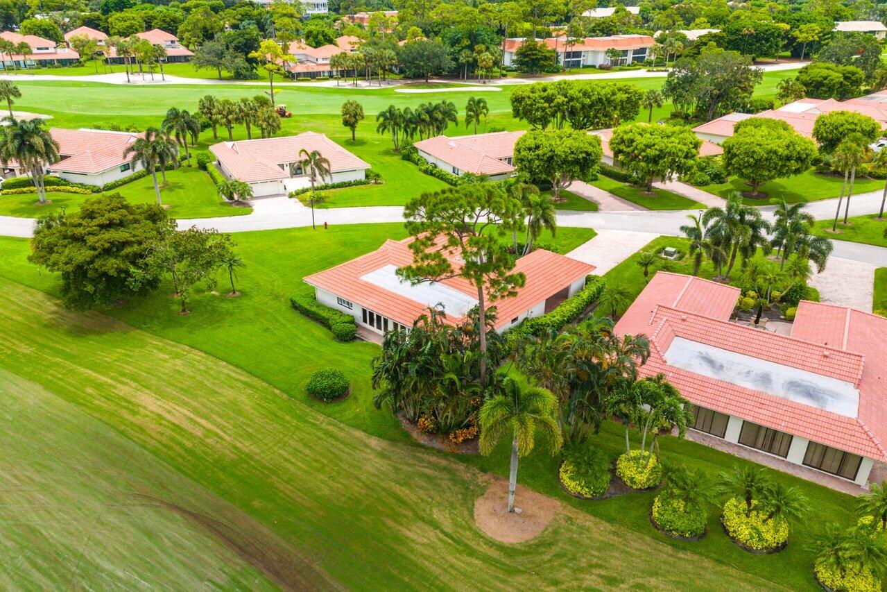 4024 Shelldrake Lane, Unit SHELLDRAKE Boynton Beach, FL 33436 - Photo 41 of 51 an aerial view of a house with yard green space and outdoor seating