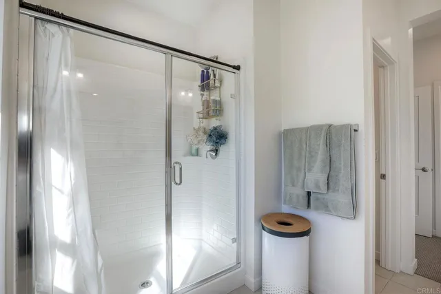 a bathroom with a shower and a sink