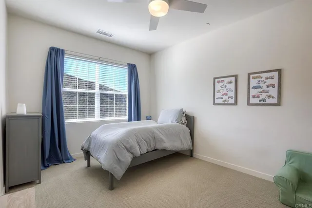 a bed room with a bed and a window