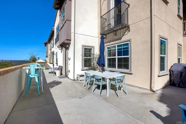 a view of a tables and chairs in patio of the house