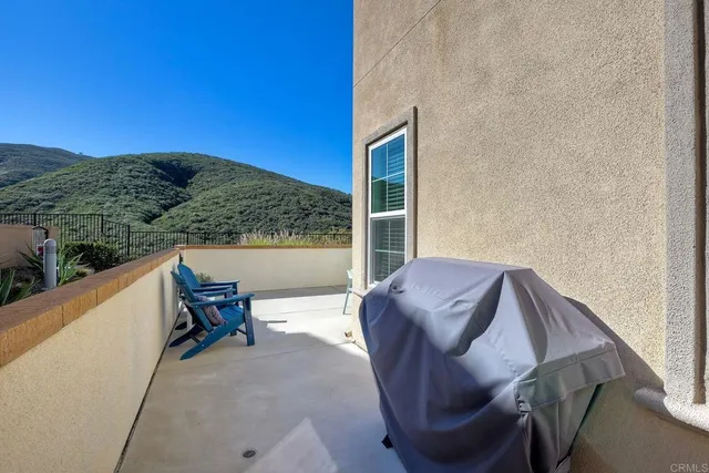 a view of balcony with furniture and a table