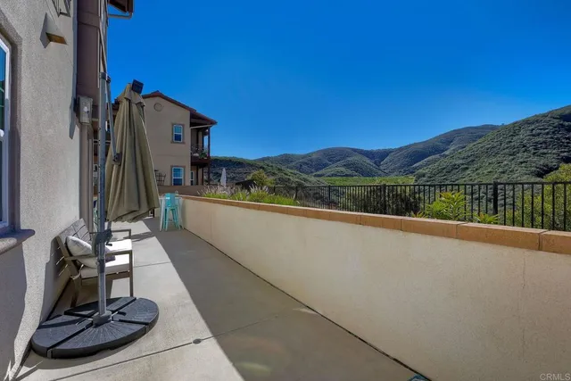 an aerial view of residential houses with outdoor space and river