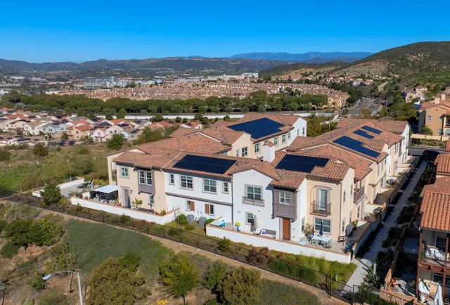 a view of a city with mountains in the background