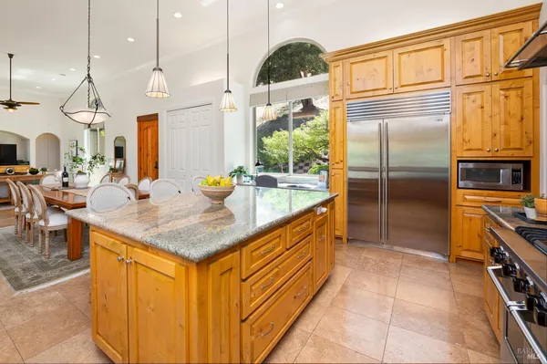 a kitchen with a stove and a clock