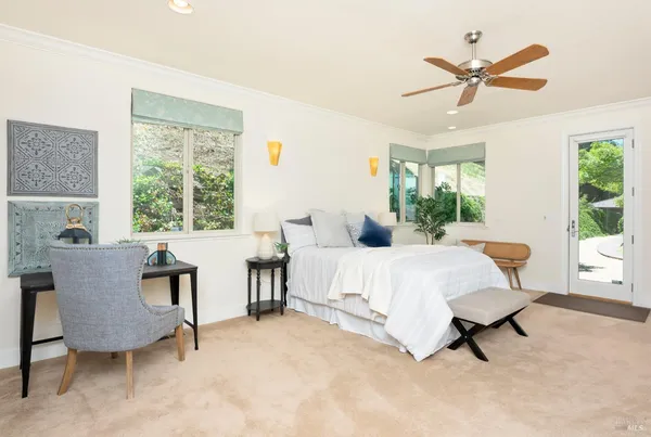 a bedroom with furniture and a bed
