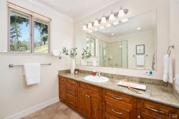 a bathroom with a shower toilet and sink