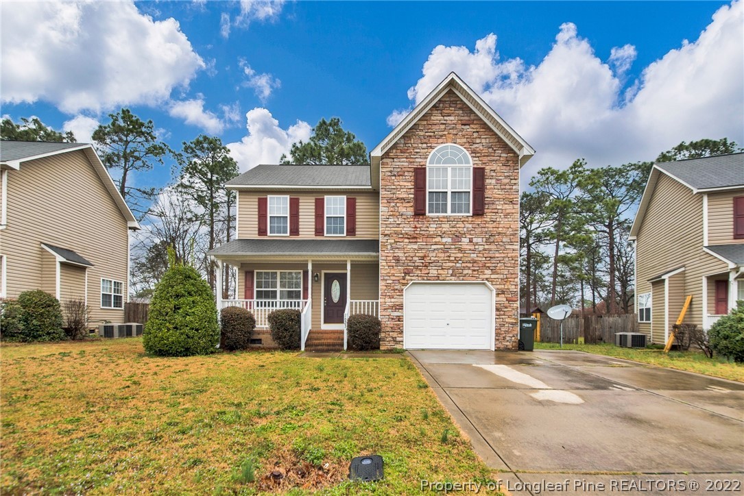 1623 Silver Ridge Court Fayetteville, NC 28304 - Photo 1 of 34 a front view of a house with a yard and garage