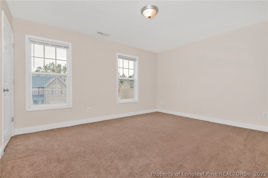 1623 Silver Ridge Court Fayetteville, NC 28304 - Photo 19 of 34 an empty room with windows