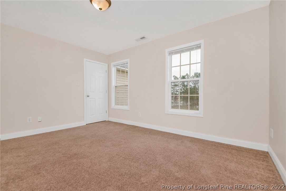 1623 Silver Ridge Court Fayetteville, NC 28304 - Photo 20 of 34 an empty room with windows
