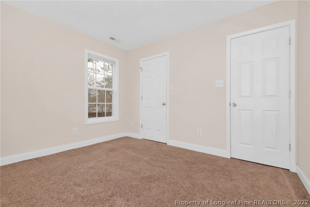 1623 Silver Ridge Court Fayetteville, NC 28304 - Photo 22 of 34 an empty room with windows