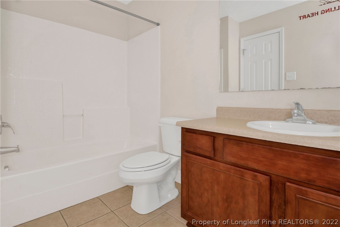 1623 Silver Ridge Court Fayetteville, NC 28304 - Photo 24 of 34 a bathroom with a sink and a toilet