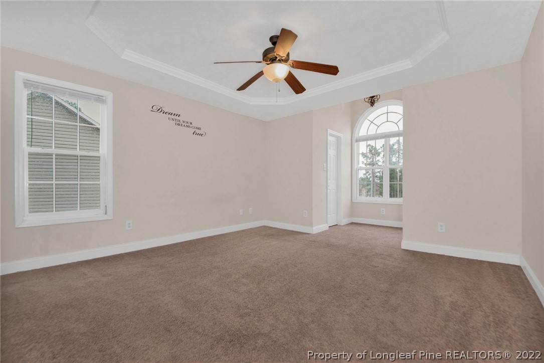 1623 Silver Ridge Court Fayetteville, NC 28304 - Photo 25 of 34 an empty room with windows and fan