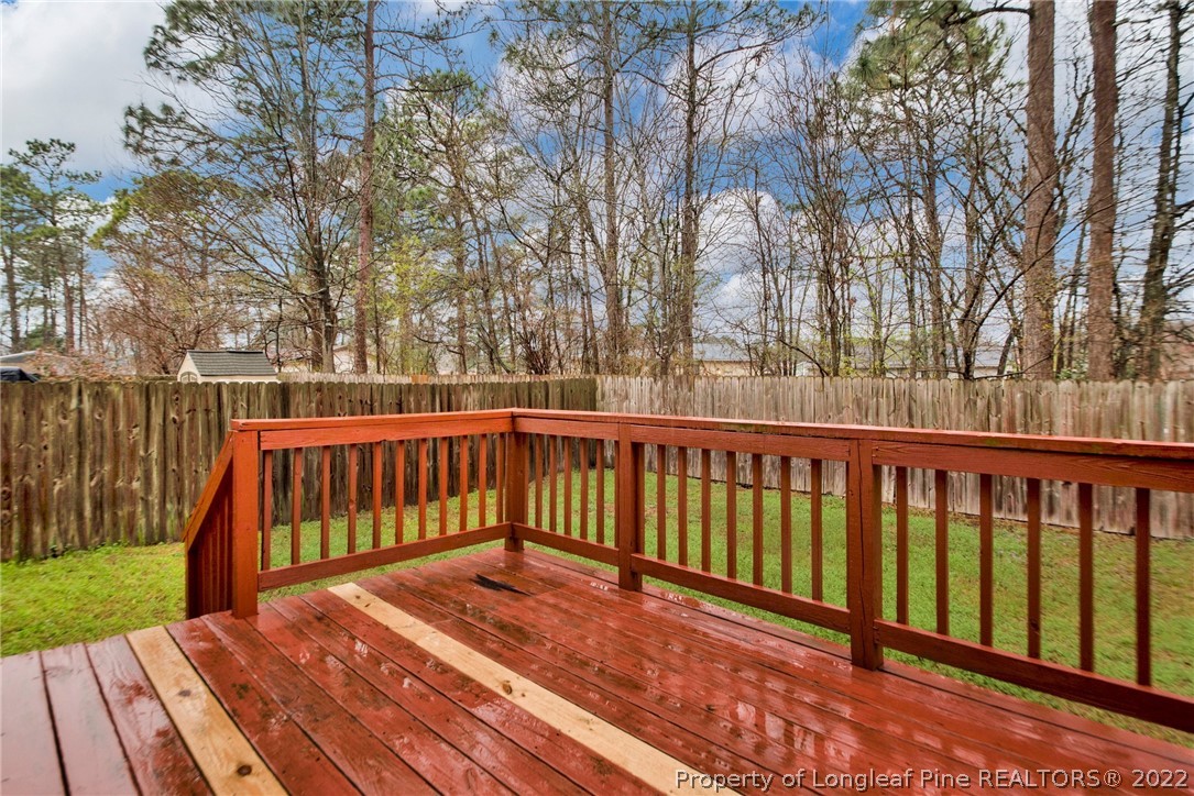 1623 Silver Ridge Court Fayetteville, NC 28304 - Photo 29 of 34 a balcony with wooden floor and fence