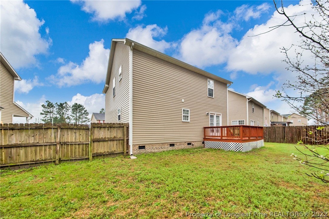 1623 Silver Ridge Court Fayetteville, NC 28304 - Photo 32 of 34 a front view of a house with a yard table and chairs
