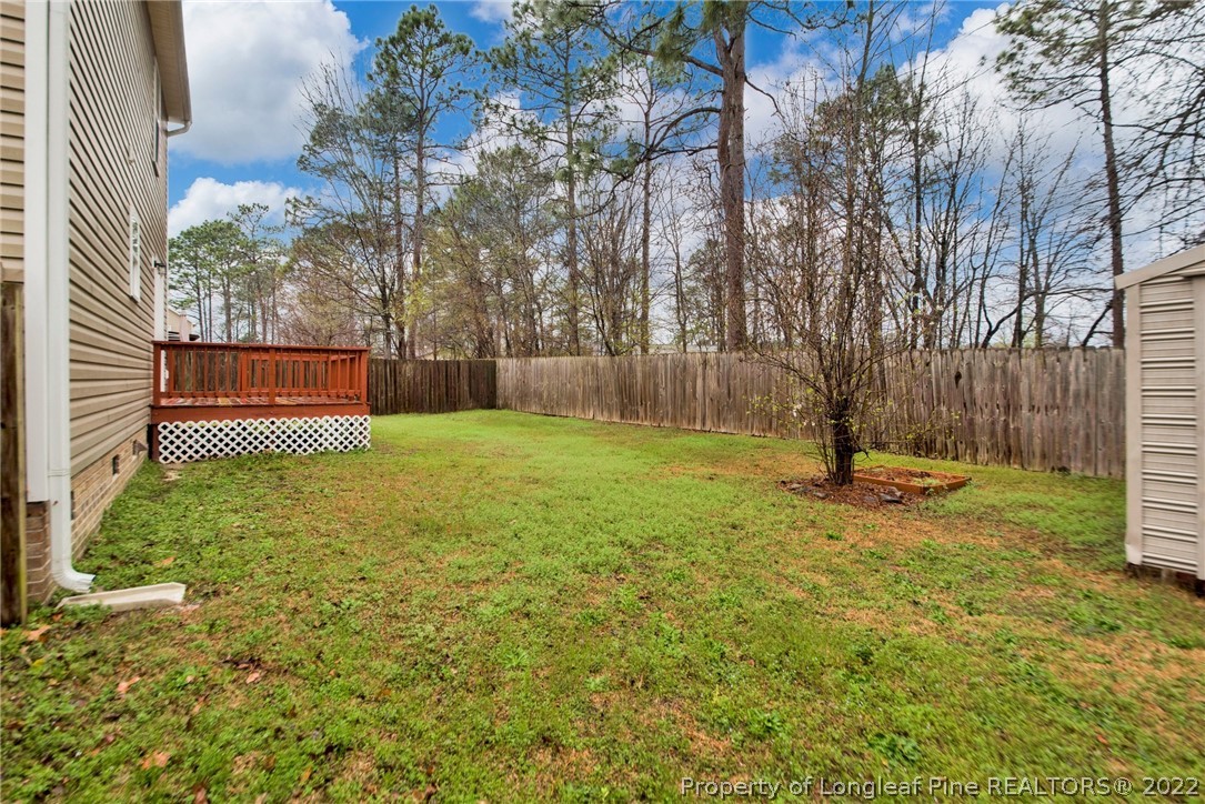 1623 Silver Ridge Court Fayetteville, NC 28304 - Photo 33 of 34 a view of a backyard with large trees