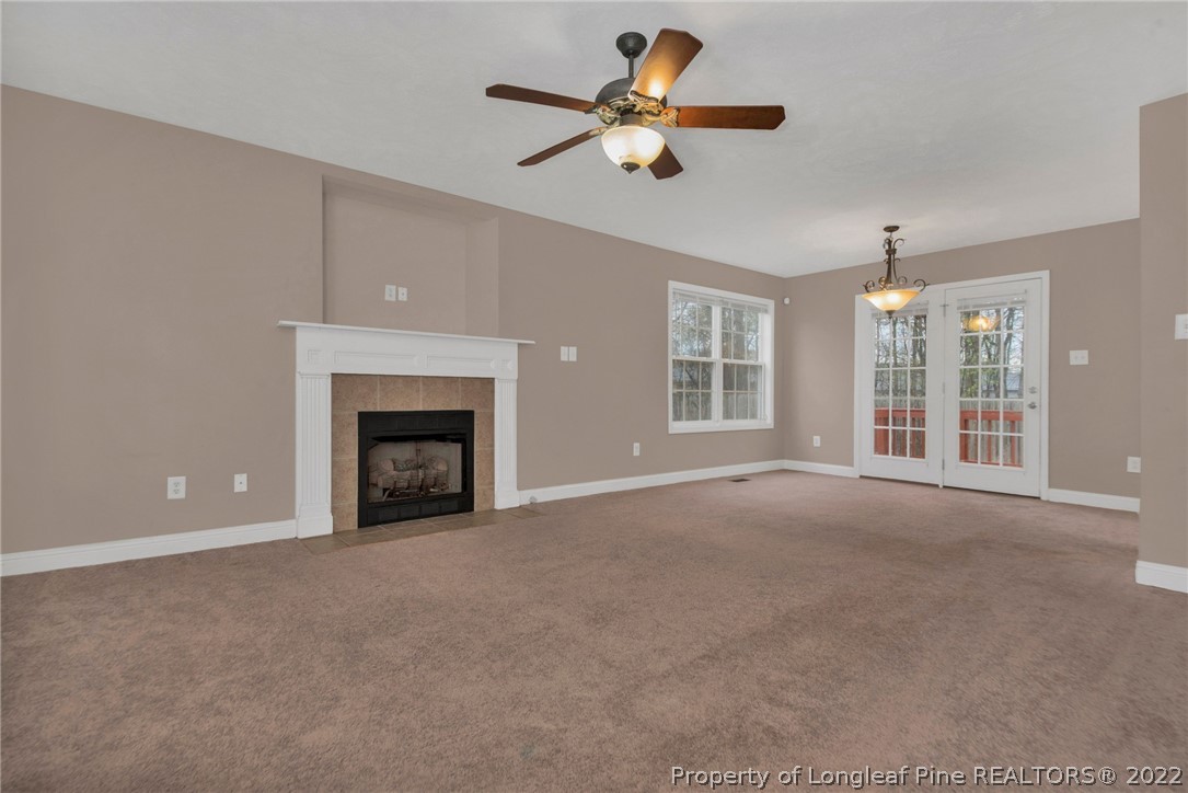 1623 Silver Ridge Court Fayetteville, NC 28304 - Photo 6 of 34 a view of an empty room with chandelier fan and windows