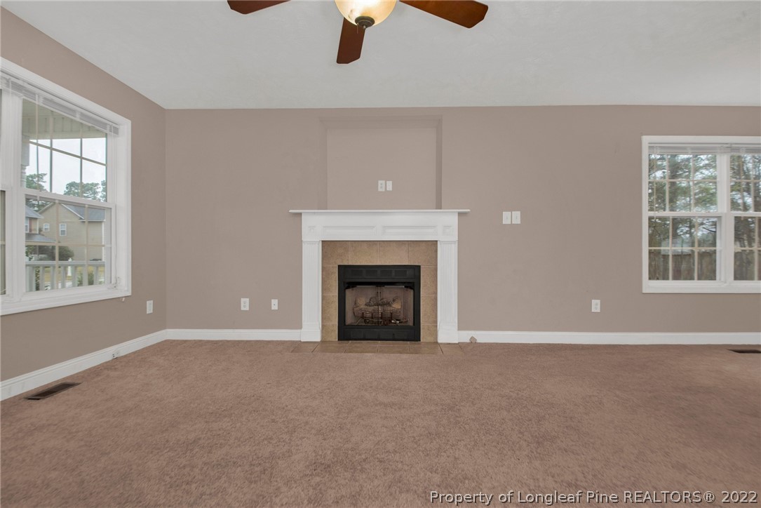 1623 Silver Ridge Court Fayetteville, NC 28304 - Photo 7 of 34 a view of an empty room with window and chandelier fan