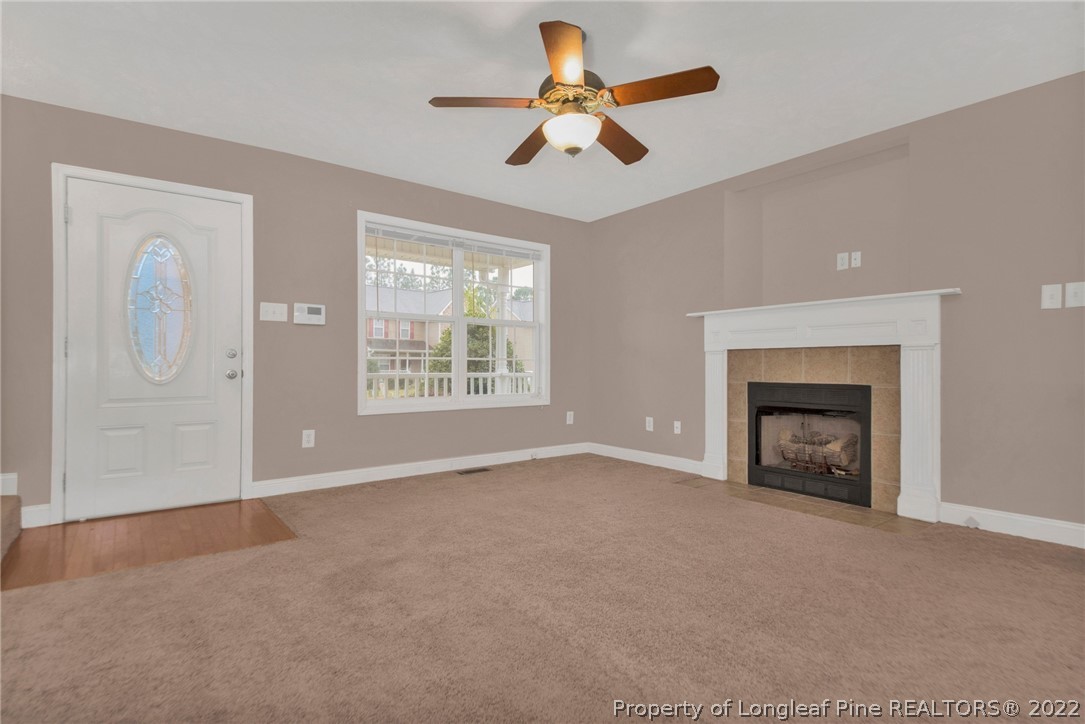 1623 Silver Ridge Court Fayetteville, NC 28304 - Photo 8 of 34 a view of an empty room with window and chandelier fan
