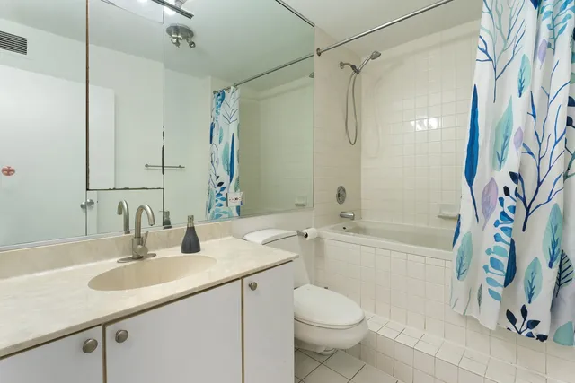 a bathroom with a sink a toilet and a bathtub