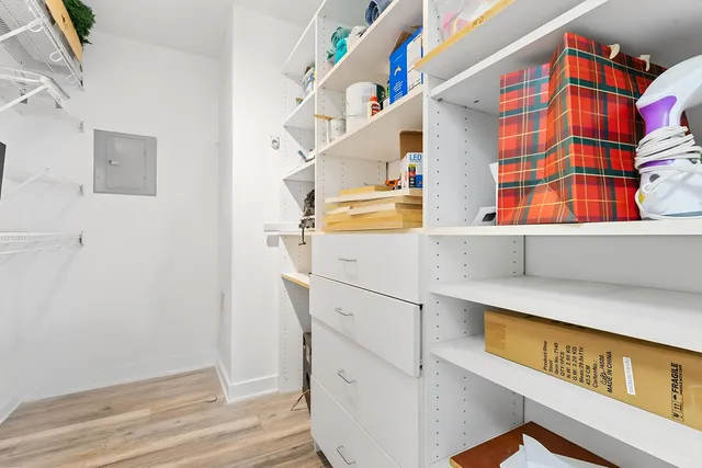 a kitchen with a cabinets and wooden floor