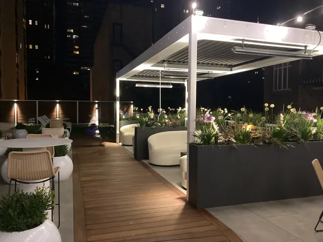 a lobby with furniture and chandelier