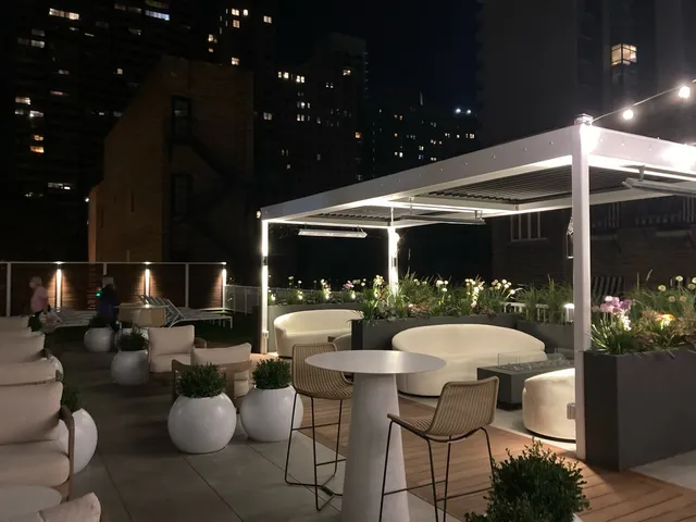 a outdoor dining space with chairs and tables