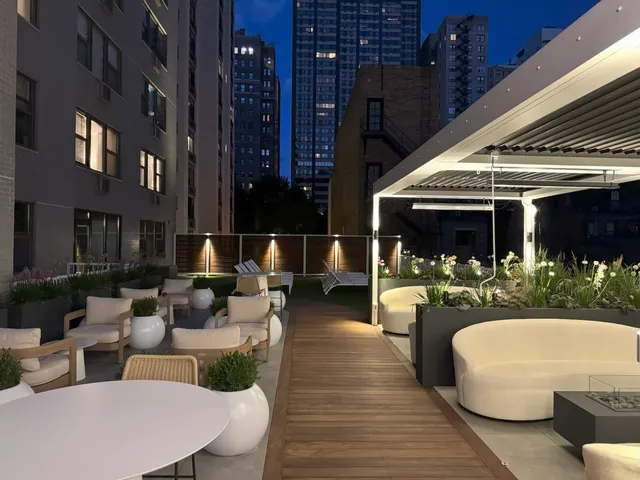 a view of a patio with couches and potted plants
