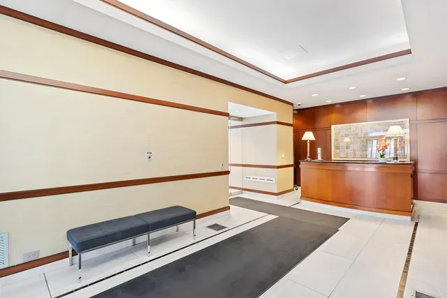 a hallway with the view of the back of a building