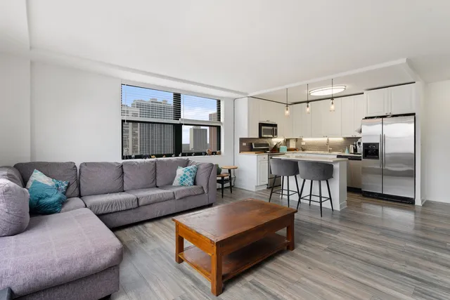 a living room with furniture and a table