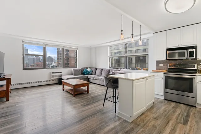 a living room with furniture and fireplace
