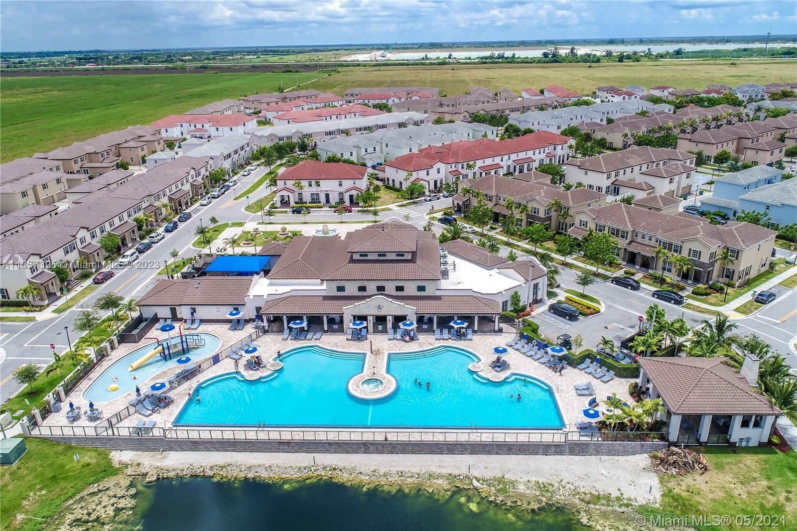 Kendall Commons Miami, FL 33196 - Photo 11 of 37 an aerial view of a house with a garden and lake view