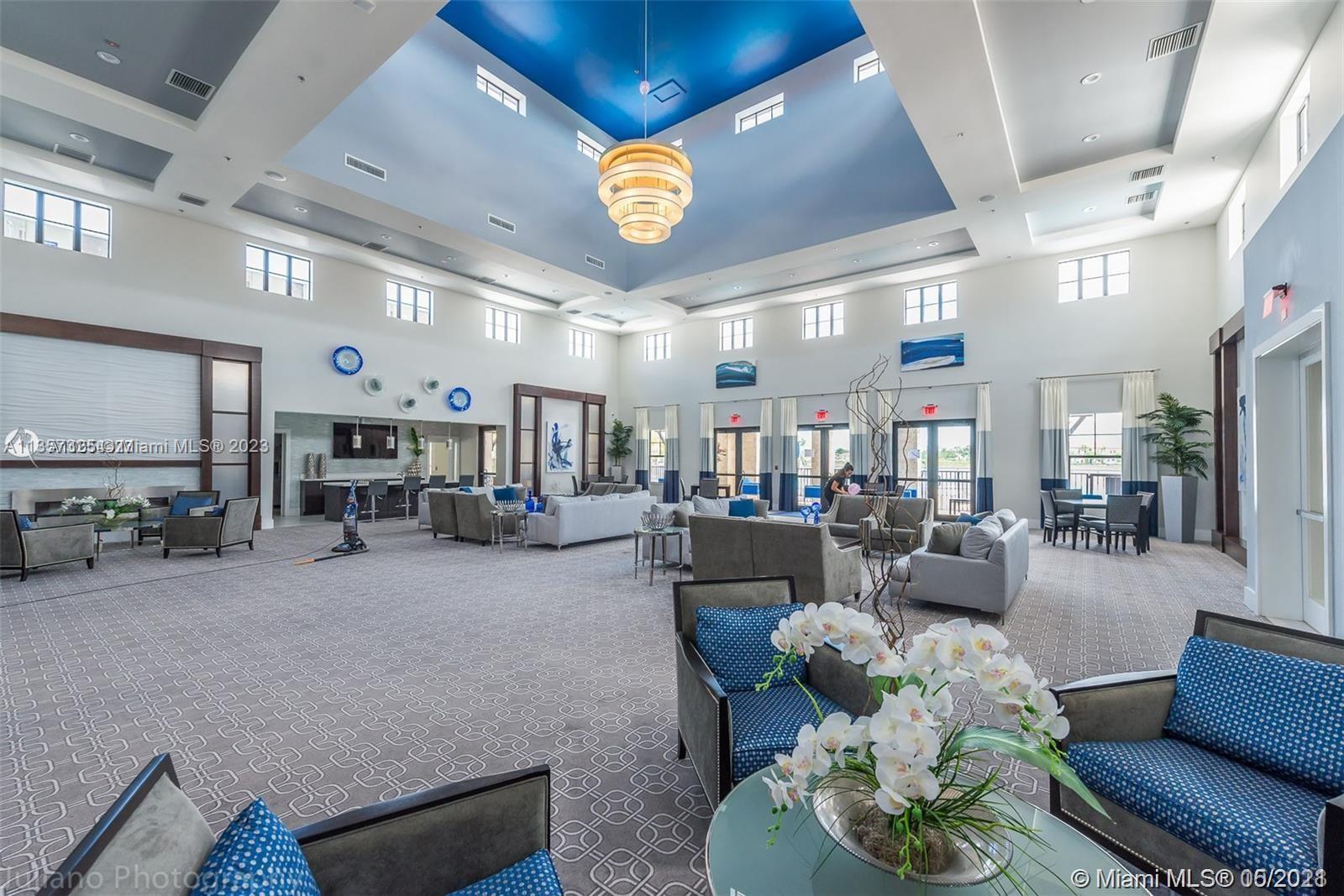 Kendall Commons Miami, FL 33196 - Photo 12 of 37 a living room with furniture and a chandelier