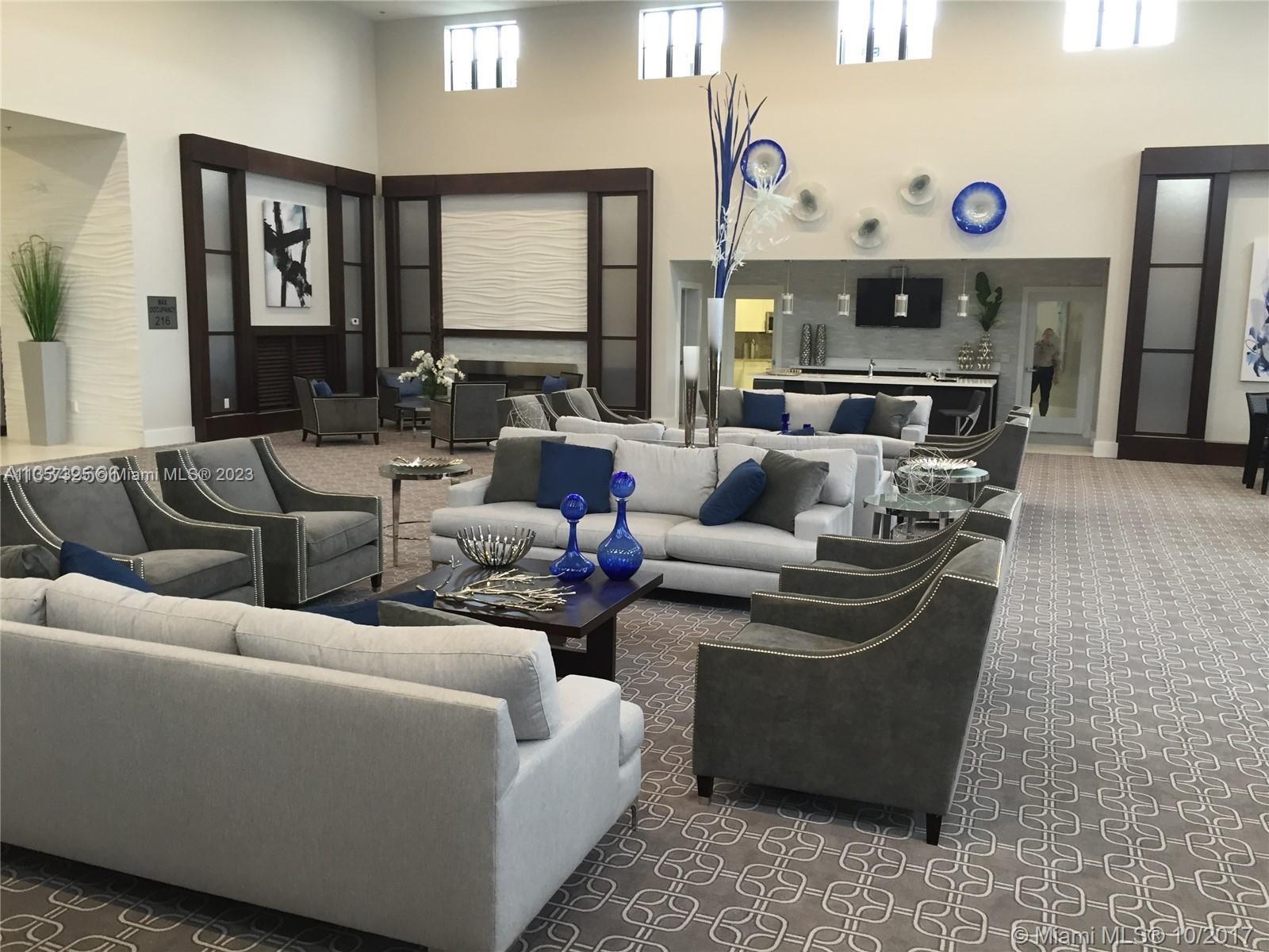 Kendall Commons Miami, FL 33196 - Photo 6 of 37 a living room with fireplace furniture and a large window