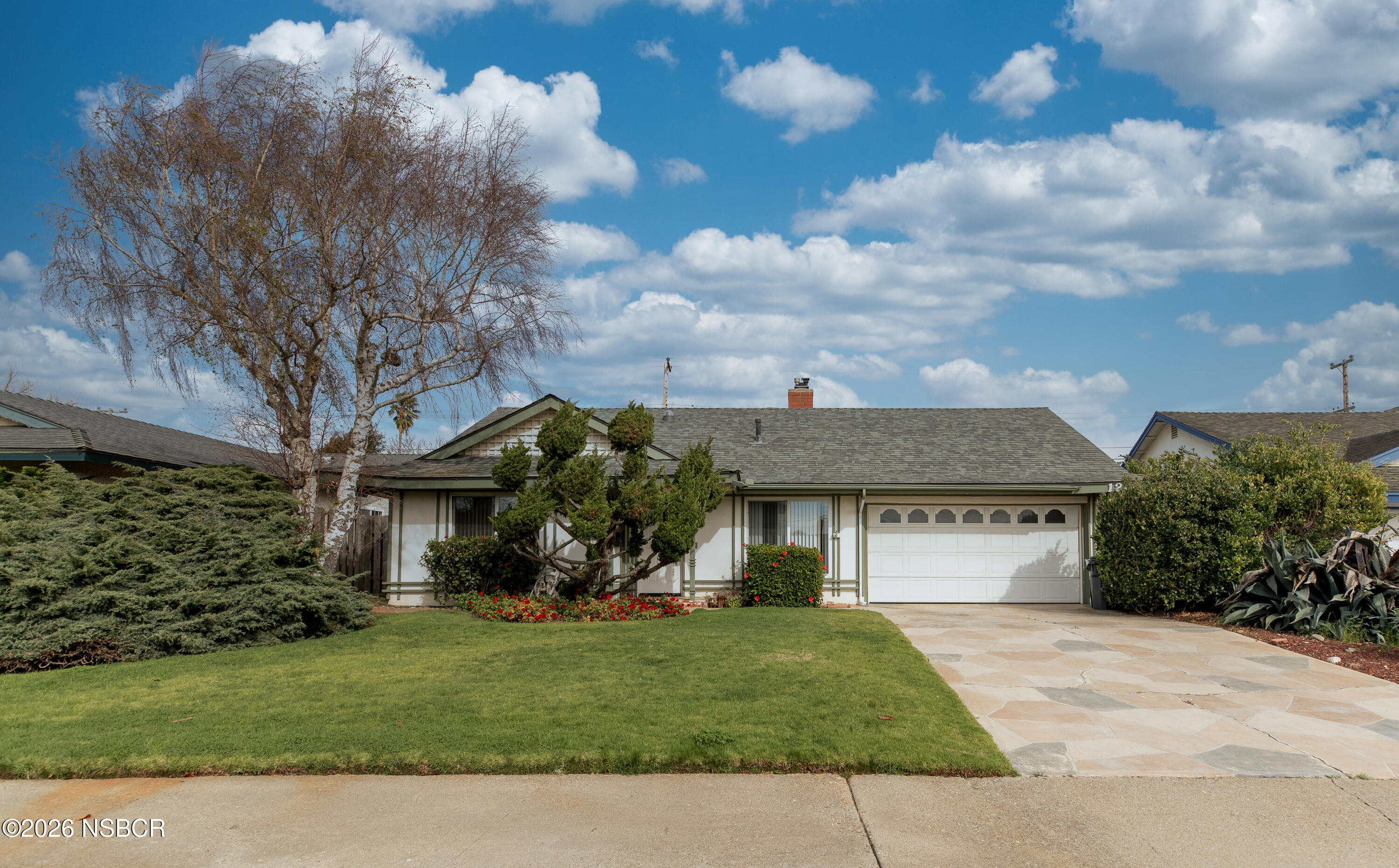 124 Princeton Place Lompoc, CA 93436 - Photo 1 of 41 a front view of a house with garden