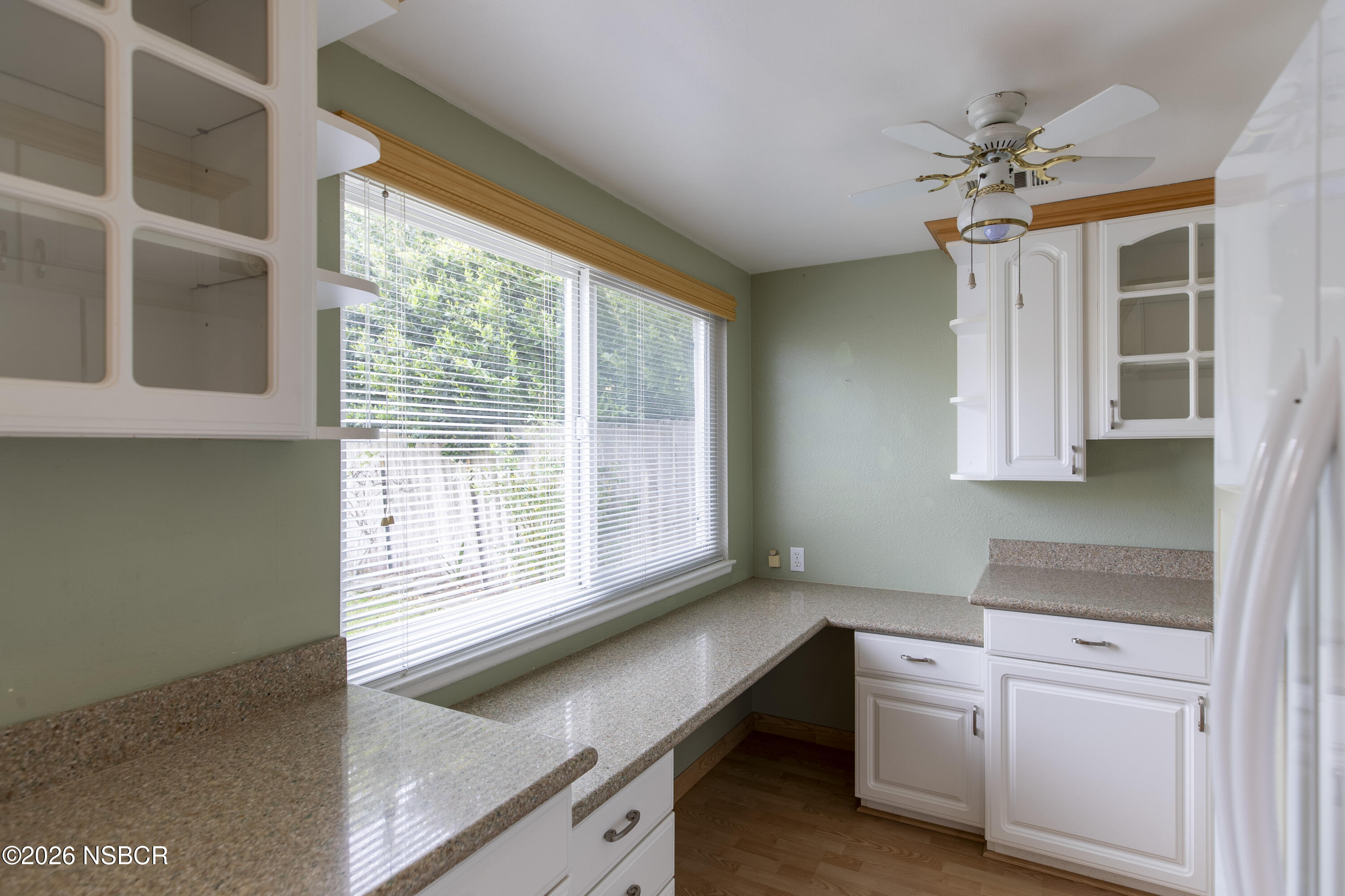 124 Princeton Place Lompoc, CA 93436 - Photo 11 of 41 a kitchen with white cabinets and a window