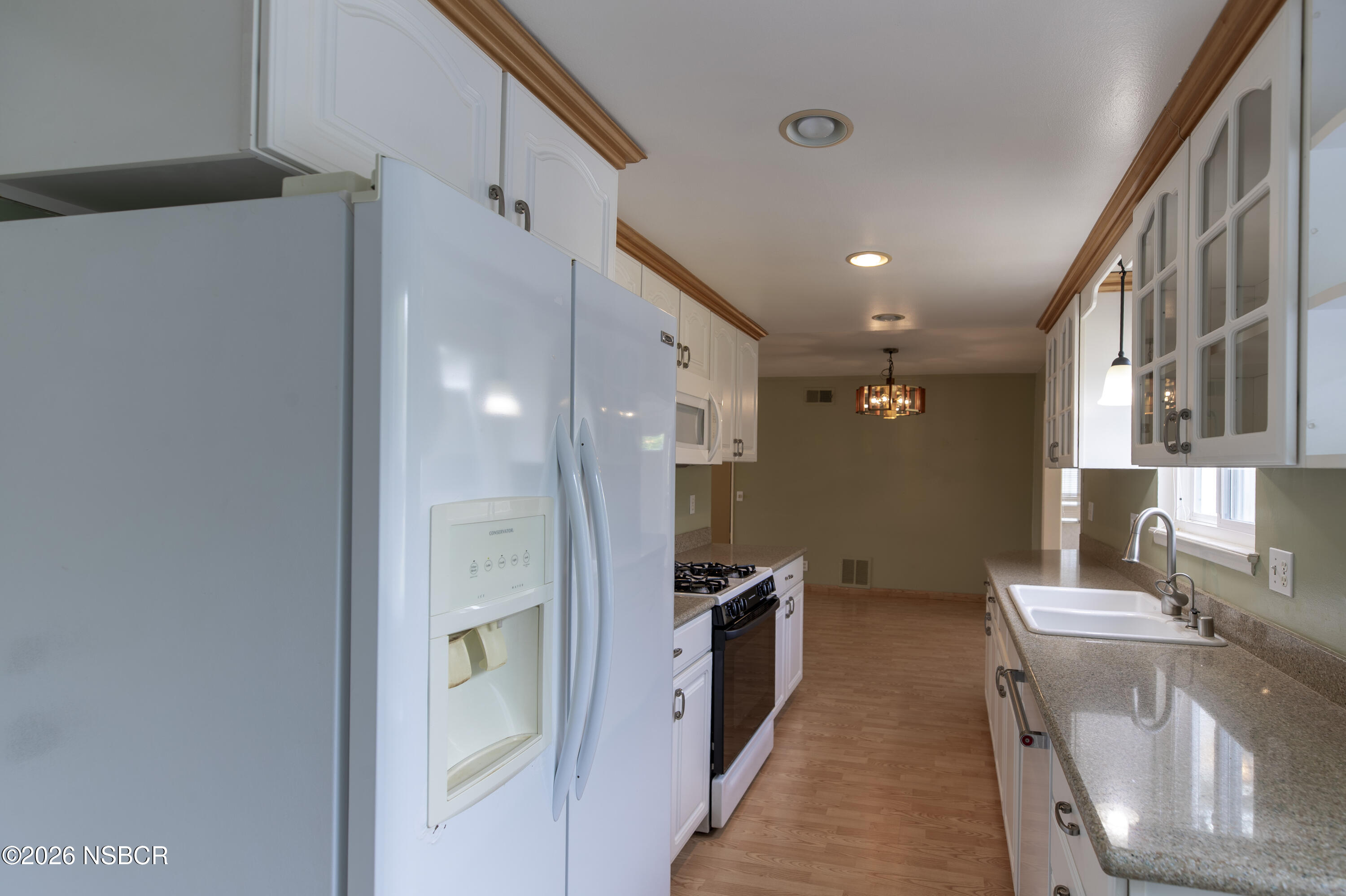 124 Princeton Place Lompoc, CA 93436 - Photo 12 of 41 a kitchen with stainless steel appliances granite countertop a refrigerator and a sink