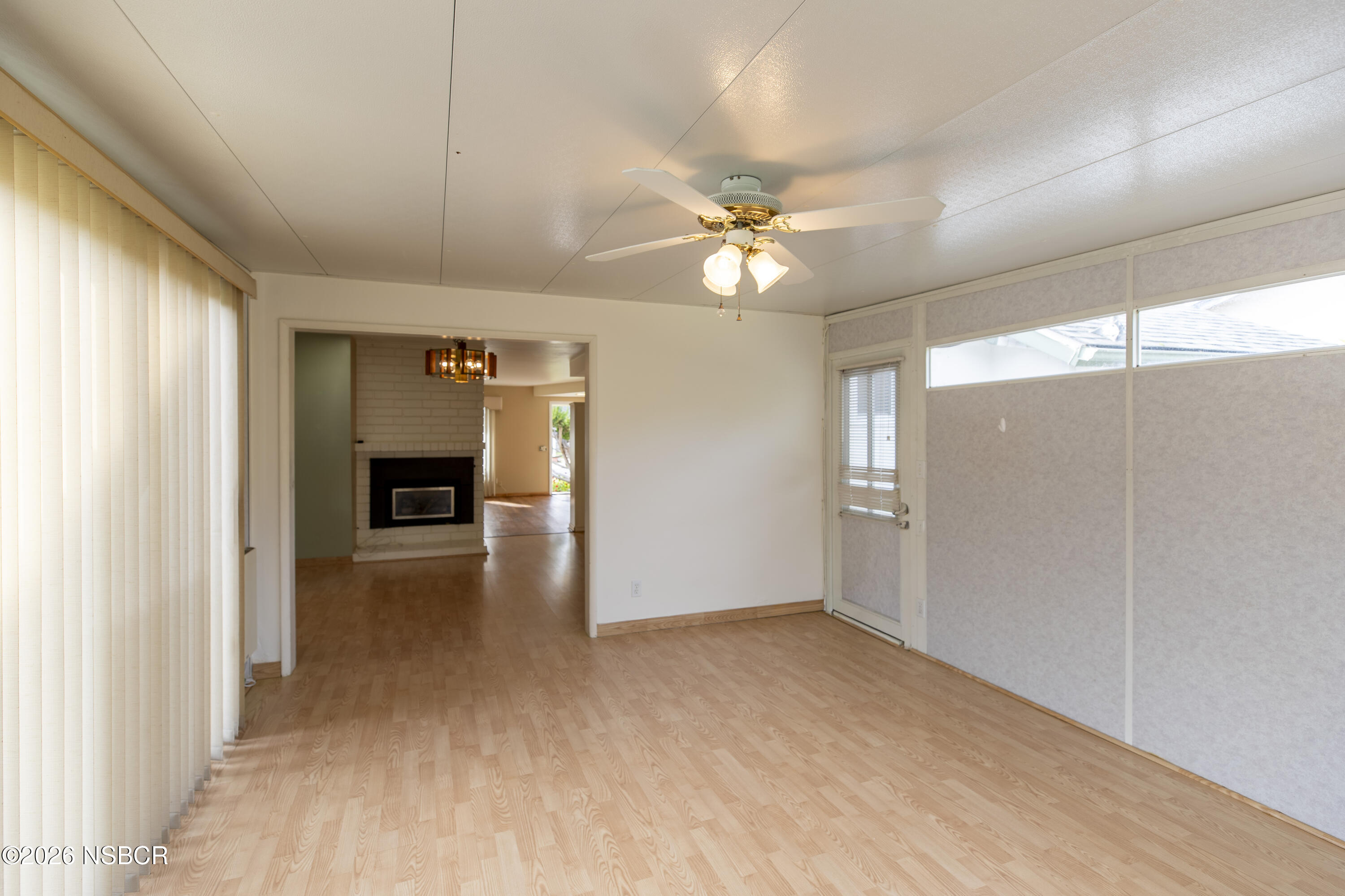 124 Princeton Place Lompoc, CA 93436 - Photo 16 of 41 a view of empty room with wooden floor and fan
