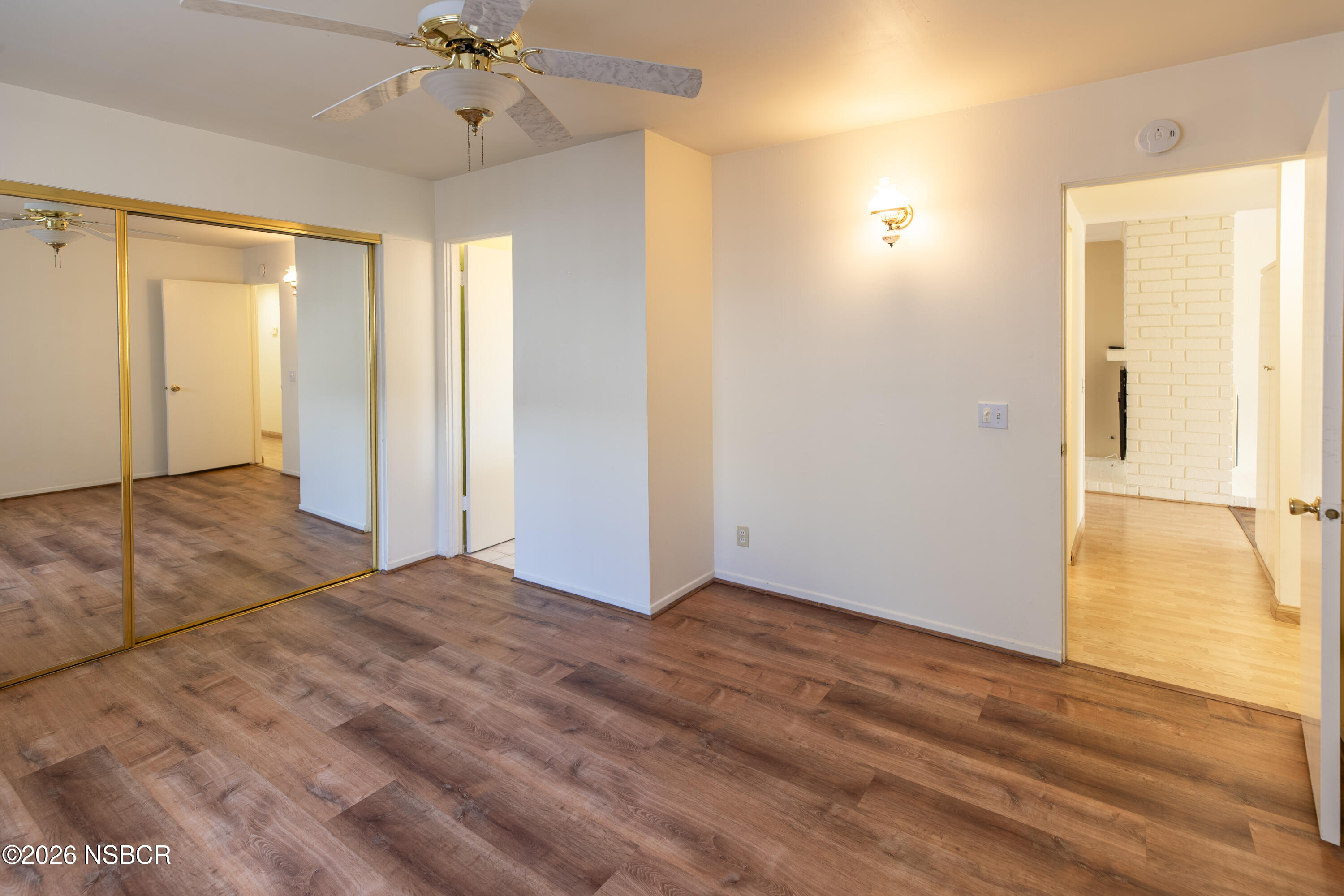 124 Princeton Place Lompoc, CA 93436 - Photo 22 of 41 a view of an empty room with wooden floor