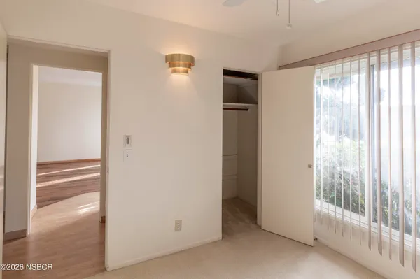 a view of empty room with floor to ceiling window